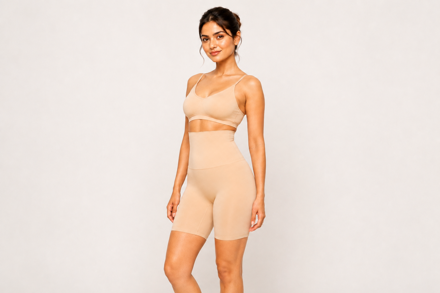 Model wearing Curvy Peach Shaper under activewear for a smooth waistline